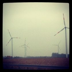 Wind turbines on field