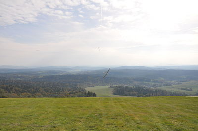 View of fields against mountain range