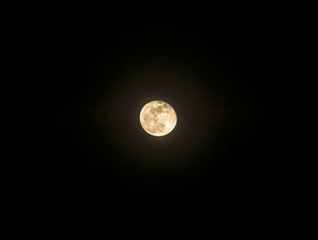 Low angle view of moon against sky at night