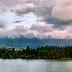 Scenic view of lake and mountains against sky