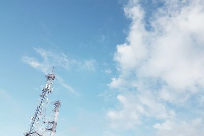 Low angle view of communications tower against sky