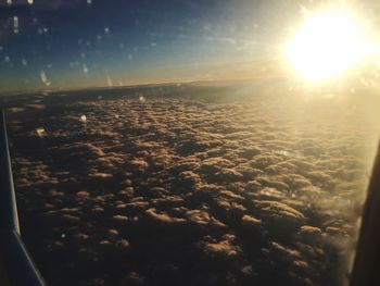 Aerial view of sea against sky during sunset