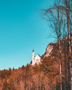 Low angle view of building against clear blue sky