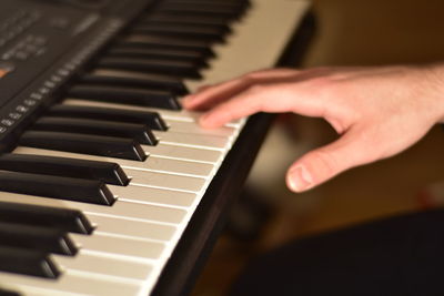 Playing piano passionately close up fingers photography