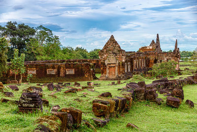 Old temple against cloudy sky