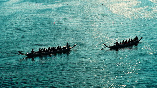 High angle view of people on boat in sea