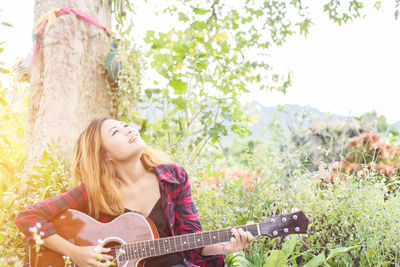 Young woman playing guitar