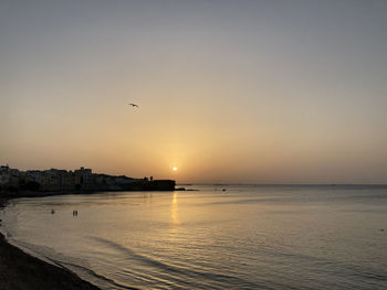 Scenic view of sea against sky during sunset