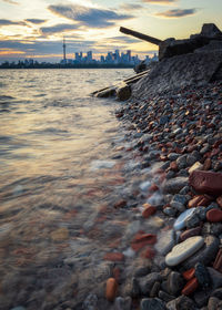 Scenic view of river against sky during sunset