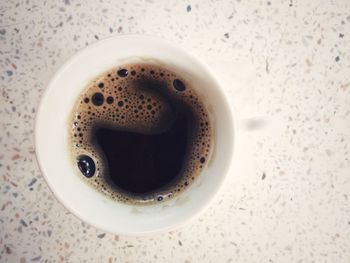 High angle view of coffee cup on table