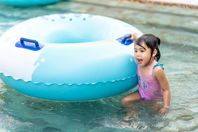 Cute girl in swimming pool