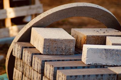 Close-up of rusty metallic blocks during sunny day