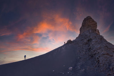 Low angle view of rock formation against sky during sunset