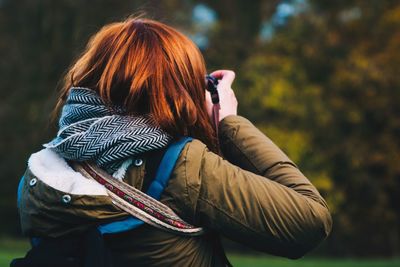 Rear view of woman with redhead