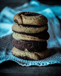 Close-up of biscuits stacked on fabric