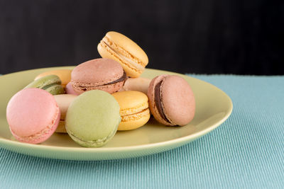 Close-up of macaroons in plate on table