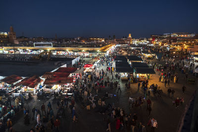 High angle view of people on street at night