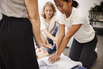 Teacher giving first aid training