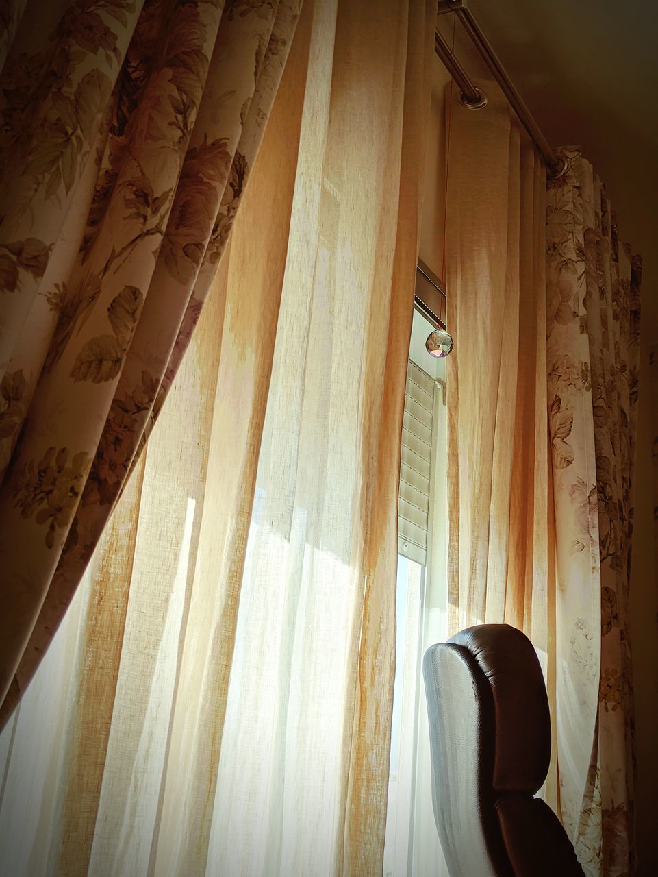 LOW ANGLE VIEW OF CURTAIN HANGING IN HOUSE