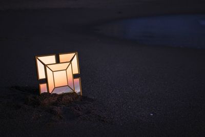 High angle view of illuminated lamp on beach