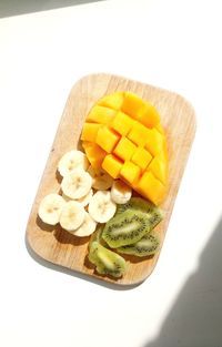 High angle view of chopped fruit on cutting board