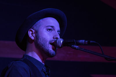 Portrait of a young man playing guitar