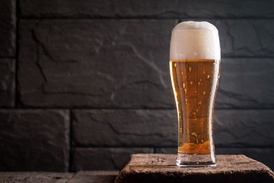 Close-up of beer glass on table