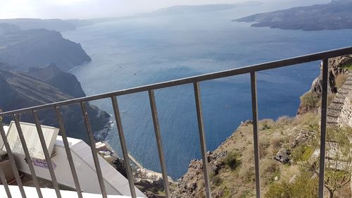 Scenic view of sea and mountains against sky