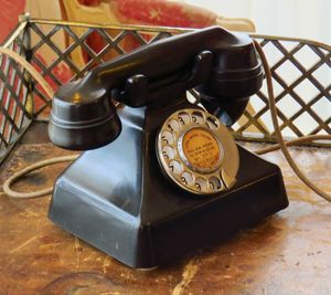 Close-up of telephone booth on table