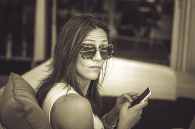 Young woman using mobile phone