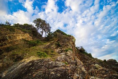 Low angle view of rocks against sky