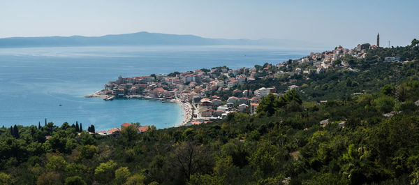 High angle view of trees and sea against sky