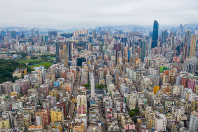 Aerial view of modern buildings in city against sky