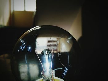 Close-up of illuminated light bulb