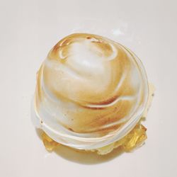 Close-up of ice cream over white background