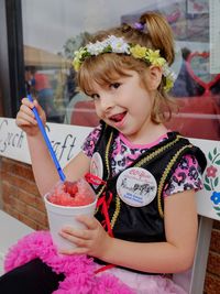 Portrait of girl holding ice cream