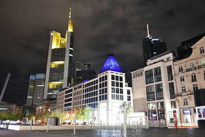 Illuminated buildings in city at night