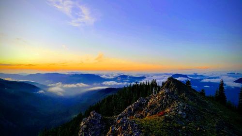 Scenic view of mountains against sky during sunset