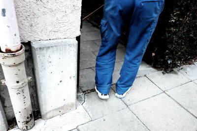 Low section of man standing on floor