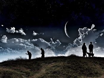 Scenic view of grassy field against sky