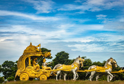 Holly arjuna chariot of mahabharata in golden color with amazing sky background