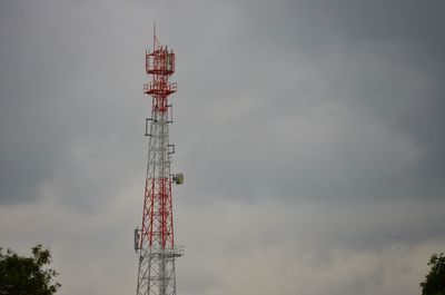 Low angle view of communications tower against sky