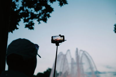 Low angle view of camera against sky