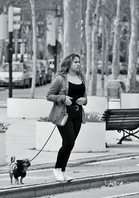 Full length of woman standing in park