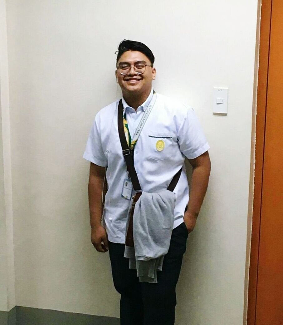 one person, real people, standing, smiling, looking at camera, three quarter length, mid adult men, front view, portrait, indoors, happiness, hands in pockets, uniform, occupation, men, young adult, hospital, day, one man only, adult, people