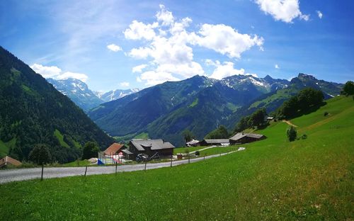 Scenic view of landscape and mountains against sky