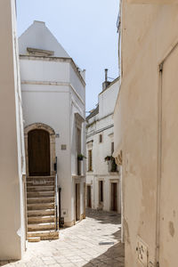 Alley amidst buildings in city