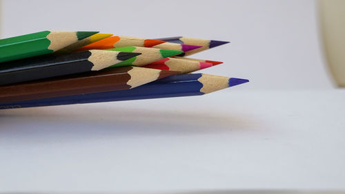 Close-up of colored pencils on table