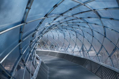 Low angle view of bridge against buildings in city