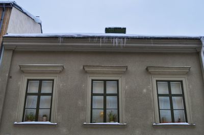 Low angle view of building during winter